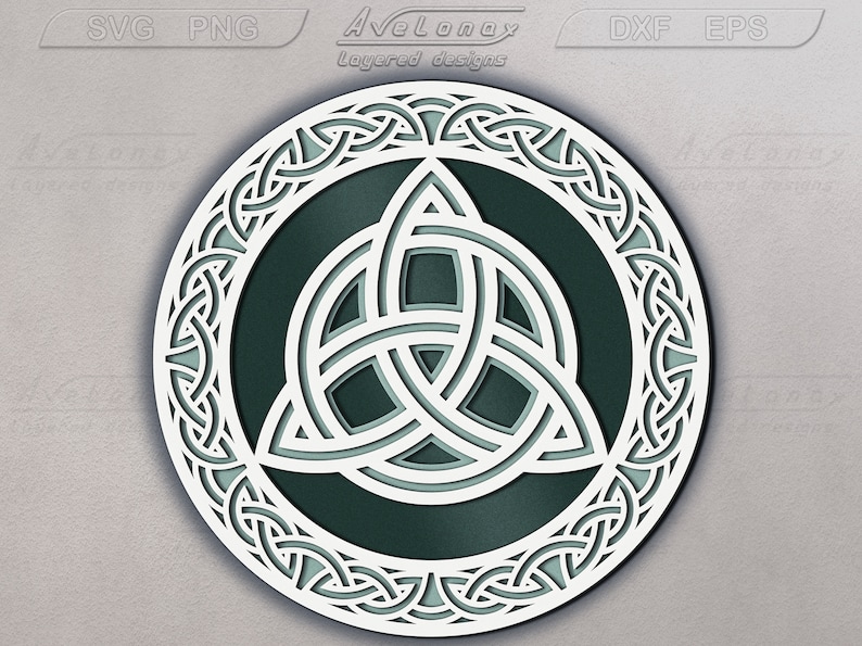 May include: A white Celtic knot design with a green center, in a circular shape. The knot is intricate and detailed, with a three-leaf clover design in the center.