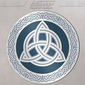 May include: A blue and white Celtic knot design with a triquetra in the center. The design is circular and has a detailed border.