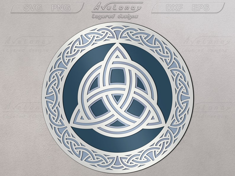 May include: A blue and white Celtic knot design with a triquetra in the center. The design is circular and has a detailed border.