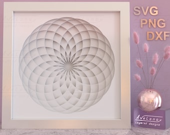 May include: A white geometric design with a circular shape and a layered effect, framed in a white frame. The design is reminiscent of a flower or mandala. The image is set against a pink background with a vase of pink pampas grass and a gold vase.