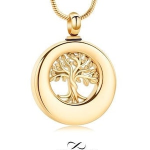 Peut inclure: Collier avec pendentif en or ton sur ton représentant un arbre de vie. Le pendentif est de forme ronde avec un centre creux, parfait pour contenir des cendres ou d'autres souvenirs.