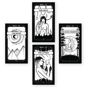 May include: Four black and white tarot cards with illustrations of The Moon, The Devil, The Lovers, and The High Priestess. Each card has a title and Roman numeral at the bottom.