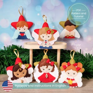 May include: Handmade felt angel ornaments in star shapes, with gold hanging loops. Each ornament features a different angel design with various hair colours, outfits, and wing styles. The text "PDF Pattern and Tutorial" and "Patterns and instructions in English" are visible.