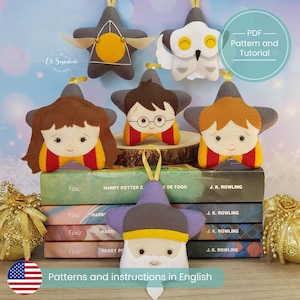 May include: A collection of handmade felt star ornaments, each depicting characters from a popular fantasy series. The ornaments are gray, yellow, red, and brown, with hanging loops. The image includes books and text that reads "Patterns and instructions in English."
