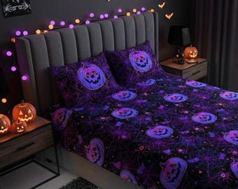May include: A Halloween-themed bed set featuring a dark purple and black color scheme. The bedding includes a repeating pattern of jack-o'-lanterns, spiderwebs, and spiders. The set includes a fitted sheet, a flat sheet, and two pillowcases. The room is decorated with string lights and carved pumpkins.