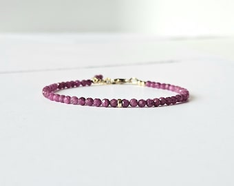 Delicate fine bracelet with facet cut gemstones of ruby, natural ruby, available in 14k gold filled and 925 sterling silver