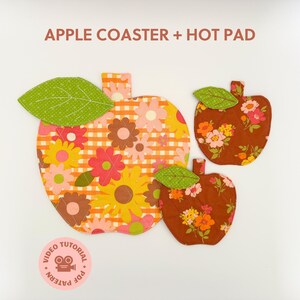 May include: Three apple-shaped fabric coasters and hot pads. The largest coaster has a yellow and orange floral pattern with a green leaf. The other two are brown with floral patterns. The text "APPLE COASTER + HOT PAD" is at the top.
