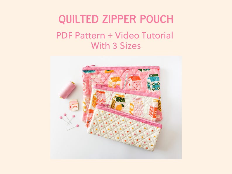 May include: Three quilted zipper pouches in varying sizes, featuring a pink and white pattern with a quilted design. The pouches are displayed with sewing notions and the text "QUILTED ZIPPER POUCH PDF Pattern + Video Tutorial With 3 Sizes".