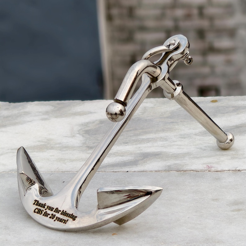 Custom engraved brass anchor paperweight close-up, nautical office desk accessory gift