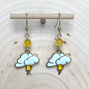 Gold Colored Enamel Cloud and lightning bolt earrings with yellow accent bead