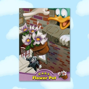 May include: A cartoon image of a flower pot being dropped from a building by a duck. The flower pot contains white and purple flowers. The text "GAGS Flower Pot" is at the bottom of the image. A cartoon character in a suit is below the flower pot.