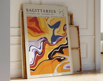 Puede incluir: Un póster enmarcado con un diseño abstracto colorido en tonos naranja, amarillo, rojo, azul y negro. El póster presenta el texto "SAGITTARIUS" y las fechas "NOVEMBER 22ND - DECEMBER 21ST".