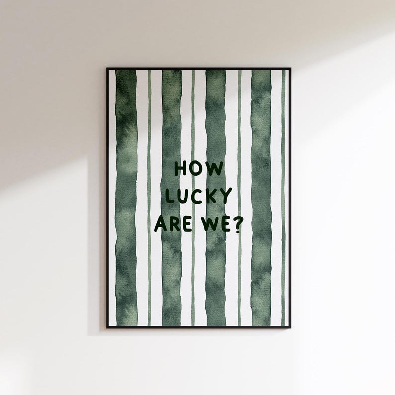 May include: A green and white striped print with the text "How lucky are we?" in black.