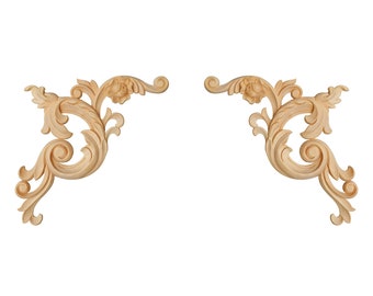 May include: A pair of ornate, wooden, decorative corner pieces with a light brown finish. The pieces are carved with intricate floral designs.
