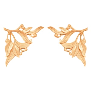May include: Two symmetrical wooden carvings of stylised branches with leaves and berries. The carvings are a light brown colour and are isolated on a white background.