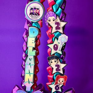 May include: A white ceramic mug with a black handle and the text "But First, Coffee" in a black, handwritten-style font. The mug is on a white surface.