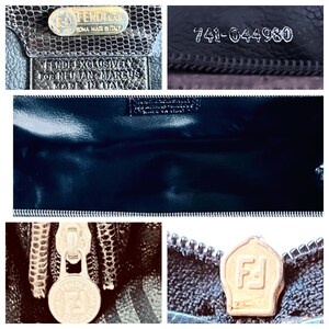 May include: Close-up of a black Fendi handbag. The bag features a textured exterior, a silver zipper, and a gold-toned metal logo. The interior is a glossy black. The text "FENDI SAS ROMA MADE IN ITALY" is visible.
