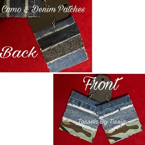 May include: A pair of denim and camo earrings with a frayed edge. The back of the earrings are made of denim with a brown stripe. The front of the earrings are made of denim with a camo fabric underneath. The earrings are labeled "Tassels By Tisse".