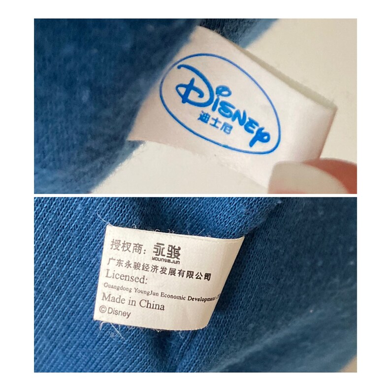 May include: White tag with the word "Disney" in blue lettering and the word "Authorized" in Chinese characters. Below the tag is a white tag with black text that reads "Authorized: YongJun, Guangdong YongJun Economic Development Co., Ltd., Licensed: Made in China, &copy;Disney."