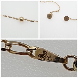 May include: Gold chain necklace with a magnetic clasp. The clasp has a hallmark that reads "585" and "KZ".