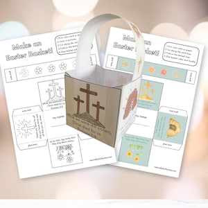 May include: A paper Easter basket kit with a handle, featuring a cross design and the text "While we were still sinners, Christ died for us." Instructions are printed on the paper. The kit is designed for DIY assembly.