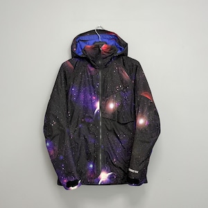 May include: Black hooded jacket with a galaxy print in shades of purple, red, and white. The jacket has a full-length zipper, a blue interior lining, and the text "GORE-TEX" on the sleeve.