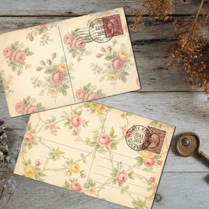 May include: Two vintage postcards with floral patterns featuring pink and yellow roses, and a bronze key. The postcards have stamps and are set on a weathered wooden surface, evoking a sense of nostalgia and romance.