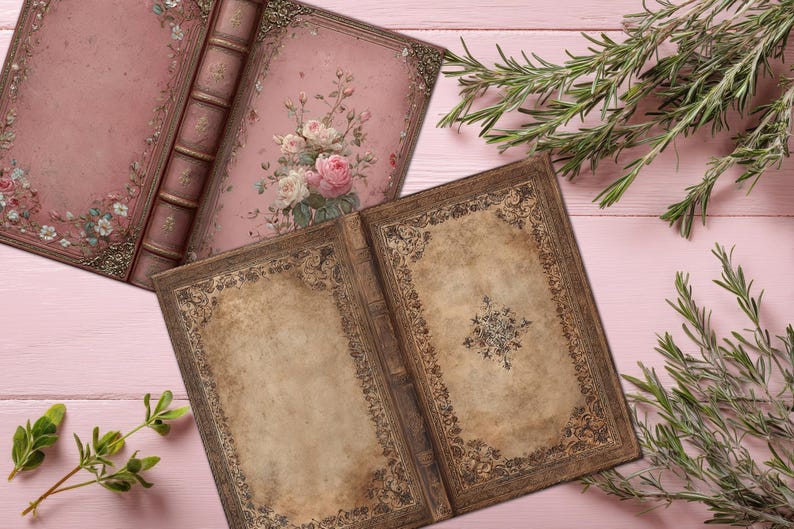 May include: Two open antique-style books with floral and ornate designs. One book features pink pages with roses, while the other has aged-looking pages with a central design. Rosemary sprigs and a pink wooden surface complete the scene.