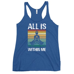 May include: A blue tank top with a vintage-style graphic of a meditating figure with the text "ALL IS WITHIN ME".