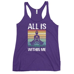 May include: Purple tank top with a vintage-style graphic of a person meditating with the text "ALL IS WITHIN ME".