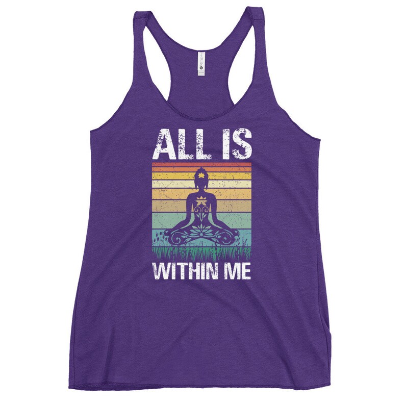 May include: Purple tank top with a vintage-style graphic of a person meditating with the text "ALL IS WITHIN ME".