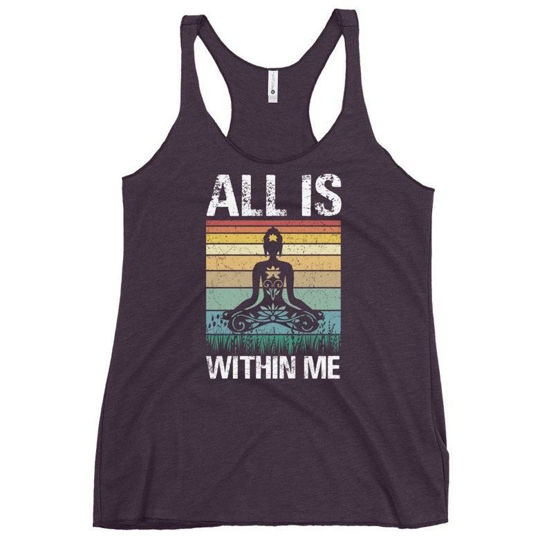 May include: Purple tank top with a vintage-style graphic of a person meditating with the text "ALL IS WITHIN ME".