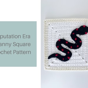 May include: A white crochet granny square with a black snake with red dots in the center. The text "Reputation Era Granny Square Crochet Pattern" is in the top left corner of the image.