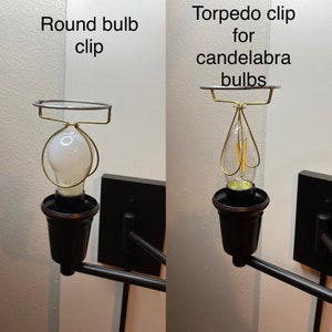 May include: Two different types of light bulb clips. The first is a round bulb clip, the second is a torpedo clip for candelabra bulbs.
