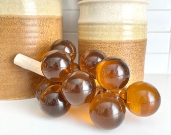Midcentury Amber Lucite Grapes on Driftwood, Orange Acrylic Decorative Grapes