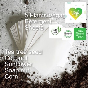 May include: A stack of white detergent sheets made from five plants: tea tree seed, coconut, sunflower, soap nut, and corn. The sheets are labeled as plant-based, vegan, and eco-friendly.