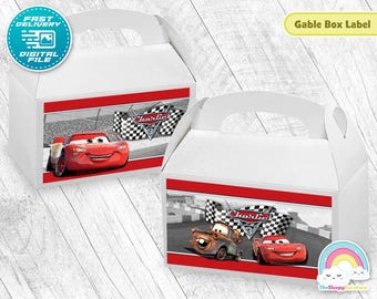 May include: Two white gable boxes with red and black racing car graphics. The boxes feature images of Lightning McQueen and Mater from the movie Cars. Text on the boxes includes "Charlie" and "Fast Delivery Digital File."