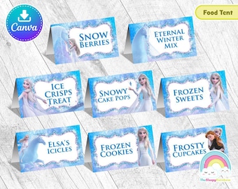 May include: Frozen themed food tent cards with images of Elsa and Anna. The cards feature text such as "Snow Berries", "Eternal Winter Mix", "Ice Crisps Treat", "Snowy Cake Pops", "Frozen Sweets", "Elsa's Icicles", "Frozen Cookies", and "Frosty Cupcakes".