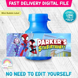 May include: A blue plastic bubble bottle featuring a rectangular label with cartoon characters and the text Parker's 5th Birthday. The label displays three stylised figures in red, blue, and purple suits against a city background.