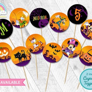 May include: Set of 10 Halloween themed cupcake toppers featuring Mickey Mouse, Minnie Mouse, Donald Duck, Goofy, and other characters. The toppers are 2 inches in diameter and have a variety of designs, including pumpkins, bats, and ghosts. The toppers are perfect for adding a festive touch to your Halloween party.