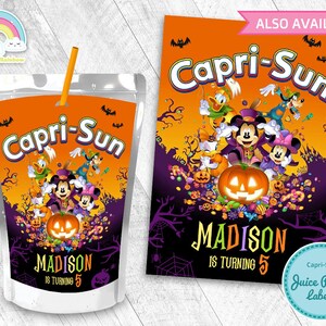 May include: Halloween-themed Capri-Sun juice pouch label featuring Mickey Mouse, Minnie Mouse, Donald Duck, and Goofy dressed in costumes. The label has an orange background with purple and black accents. The text "Capri-Sun" is in large, white letters. The text "MADISON IS TURNING 5" is in black letters.