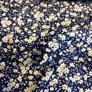 Navy Mini Daisies Floral Printed 100% Cotton Poplin Fabric. Sold by the Metre