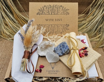 May include: A gift box with a kraft paper card that reads "WITH LOVE" and a floral design. The box contains a bundle of dried flowers, crystals, a scroll tied with twine, and a small burlap bag with rose petals.