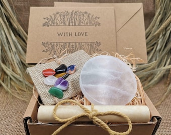 May include: A gift box containing a variety of items. Inside is a burlap bag with colorful gemstones, a large white stone, a rolled scroll, and two cards with the words "WITH LOVE". The box is tied with twine.