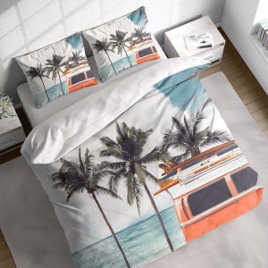 May include: A white duvet cover with a colorful print of palm trees and a vintage van with surfboards on the roof. The van is orange and white with a blue sky and ocean in the background.
