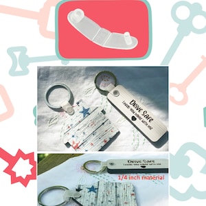 May include: Two keychains with house-shaped charms and a white background with red and blue stars. The charms are attached to a silver keyring. The keychains are made of 1/4 inch and 1/8 inch material. The keychains have the text "Drive Safe I need you home with me" engraved on them.