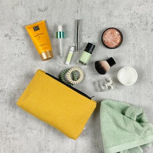 Yellow cosmetic bag made of fine waffle pique | dimensions L20 x H12 x W4cm | handmade | suitable for hand luggage bottles
