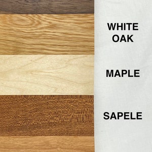 May include: Five wood samples labeled with their names: Walnut, White Oak, Maple, Sapele, and Cherry.