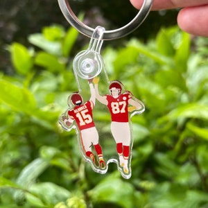 Patrick Mahomes and Travis Kelci High Five Acrylic Keychain