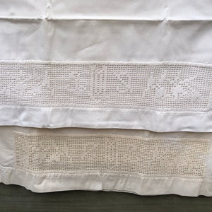 An absolutely beautiful pair of vintage pillowcases featuring "M" in filet crochet.